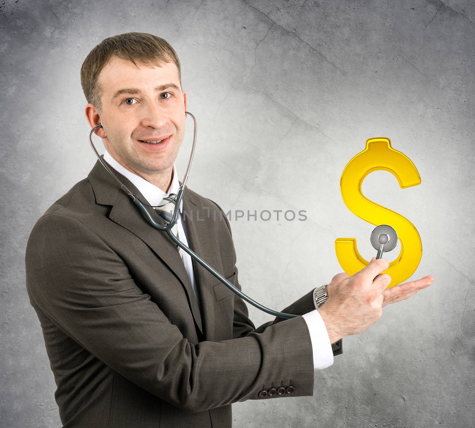 Businessman with stethoscope hearing gold dollar sign on his hand