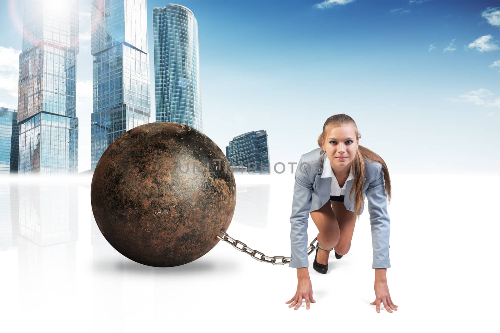 Businesswoman with iron ball isolated on cityscape background, front view