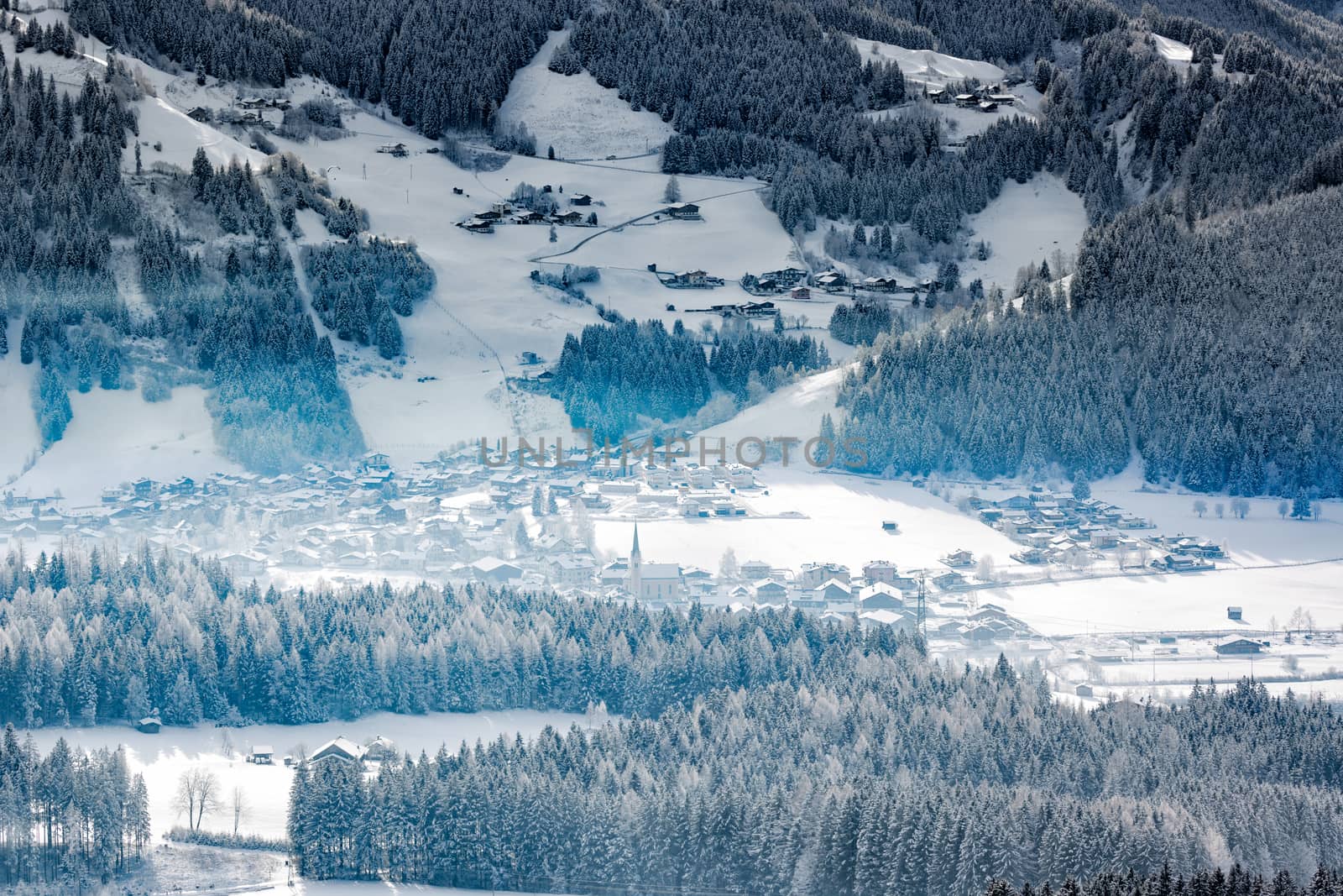 Wintery village in alpine valley, Tyrol, Austria by fisfra
