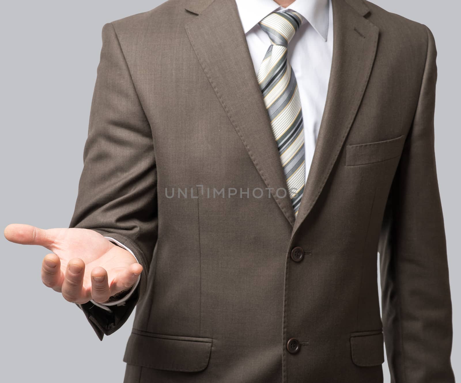 Businessman with tie and outstretched empty hand, close up view