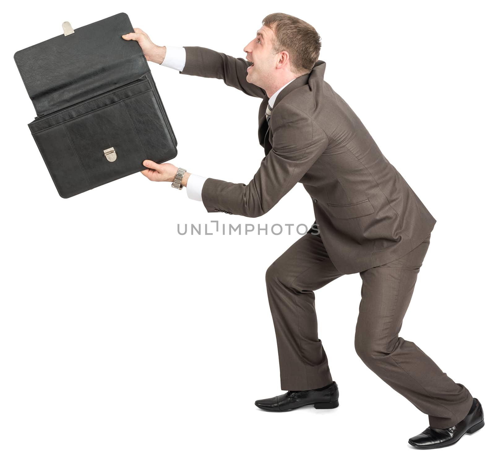 Happy businessman with open briefcase looking up isolated on white background