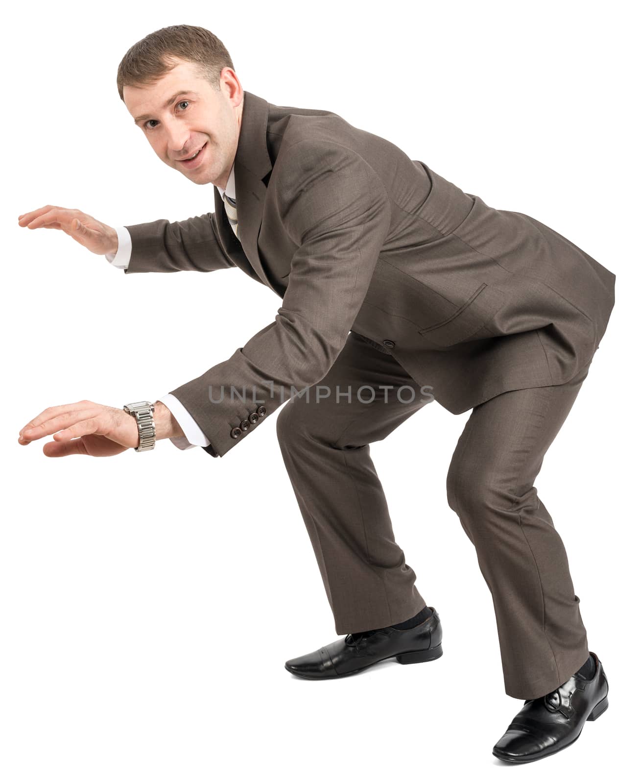 Smiling businessman balancing on empty space and looking at camera isolated on white background