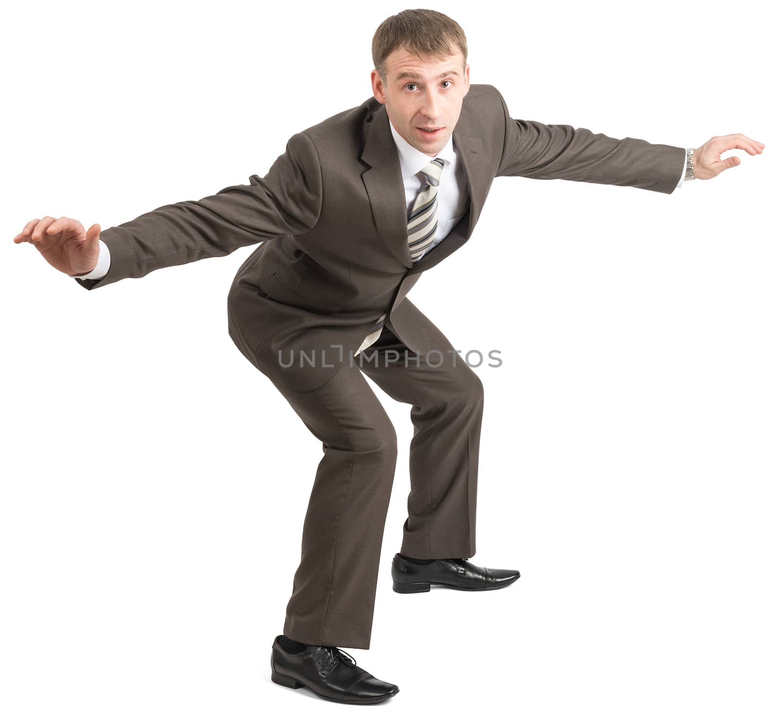 Smiling businessman balancing on empty space isolated on white 