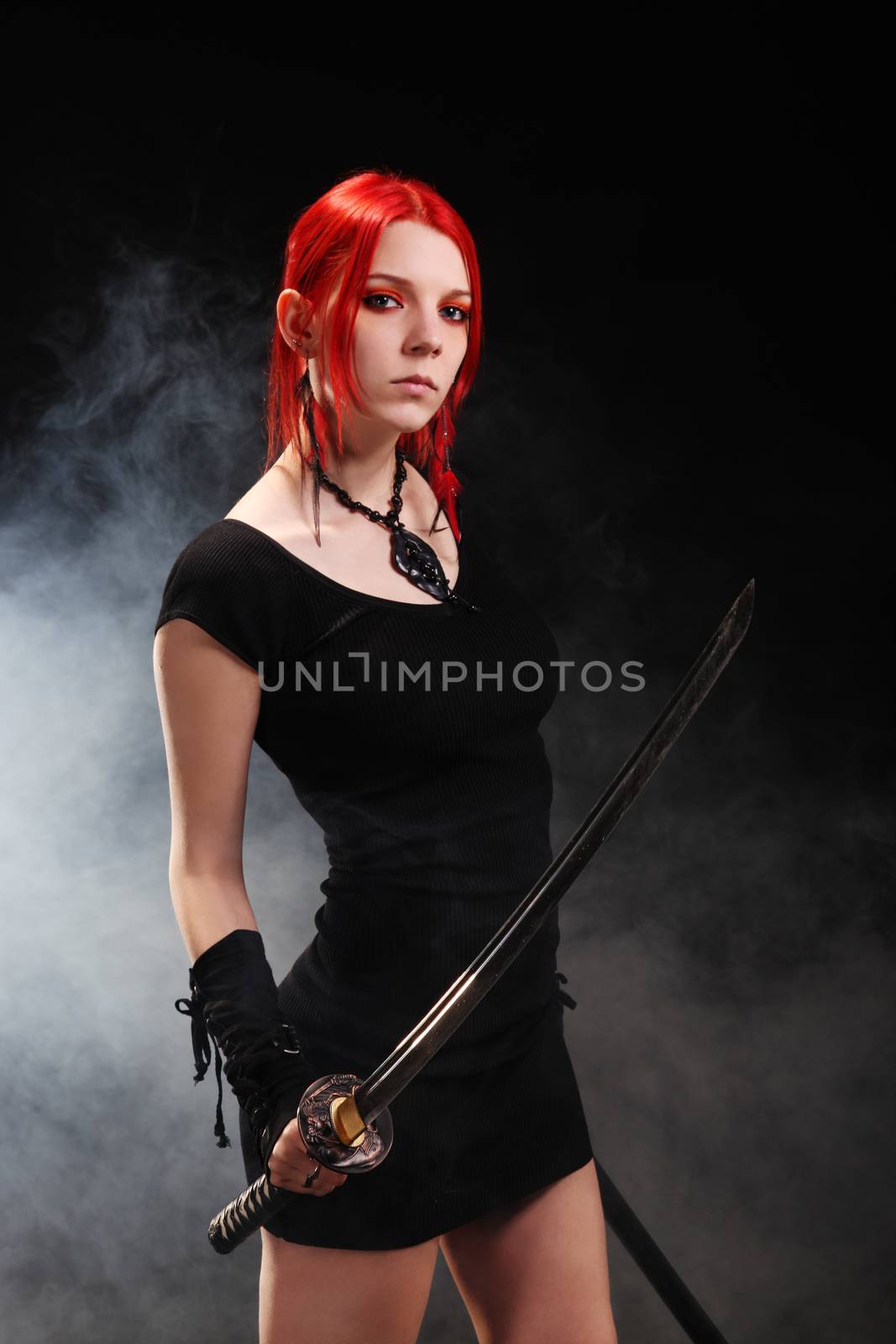 Beautiful red hair girl with katana sword