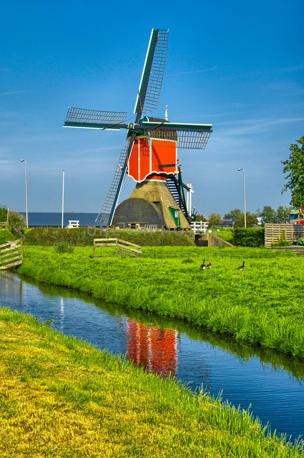 Windmills and water canal in Kinderdijk, Holland or Netherlands. Unesco world heritage site. Europe. HDR