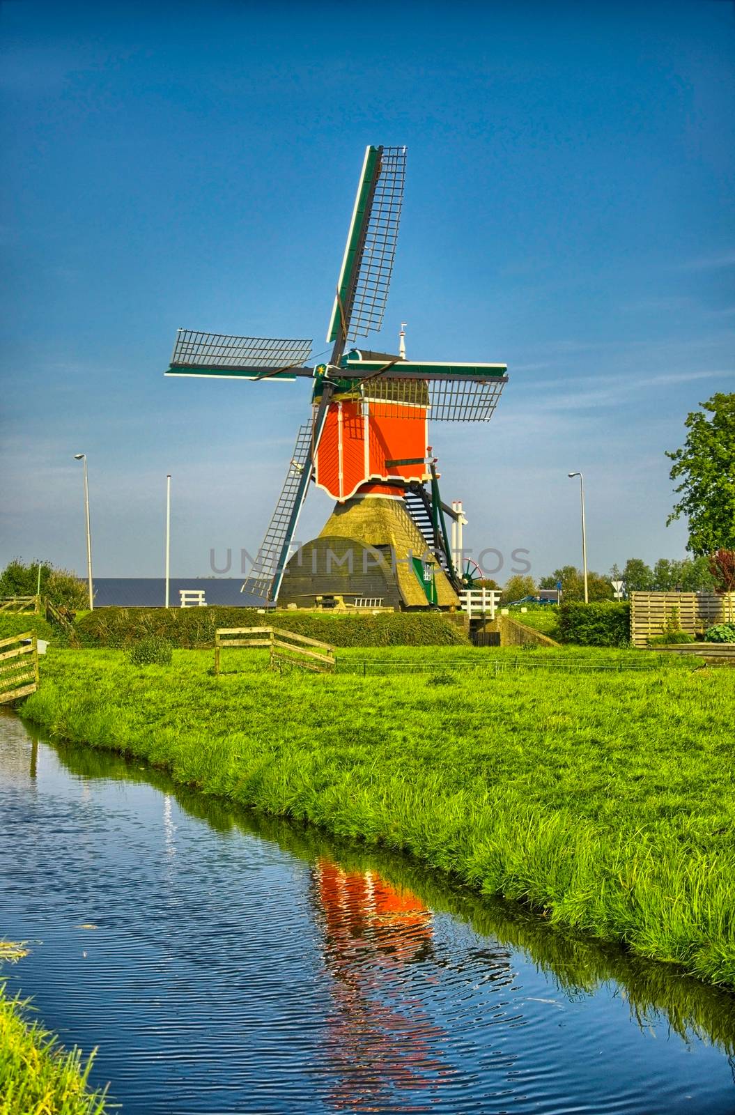 Windmills and water canal in Kinderdijk, Holland or Netherlands. by Eagle2308