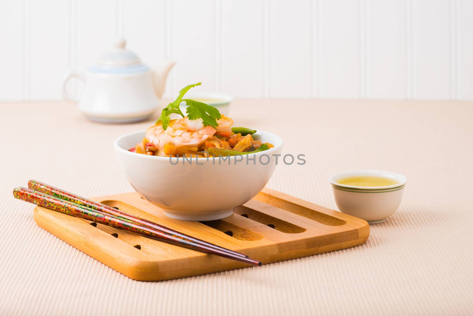 Rice noodles and shrimp in a white bowl.