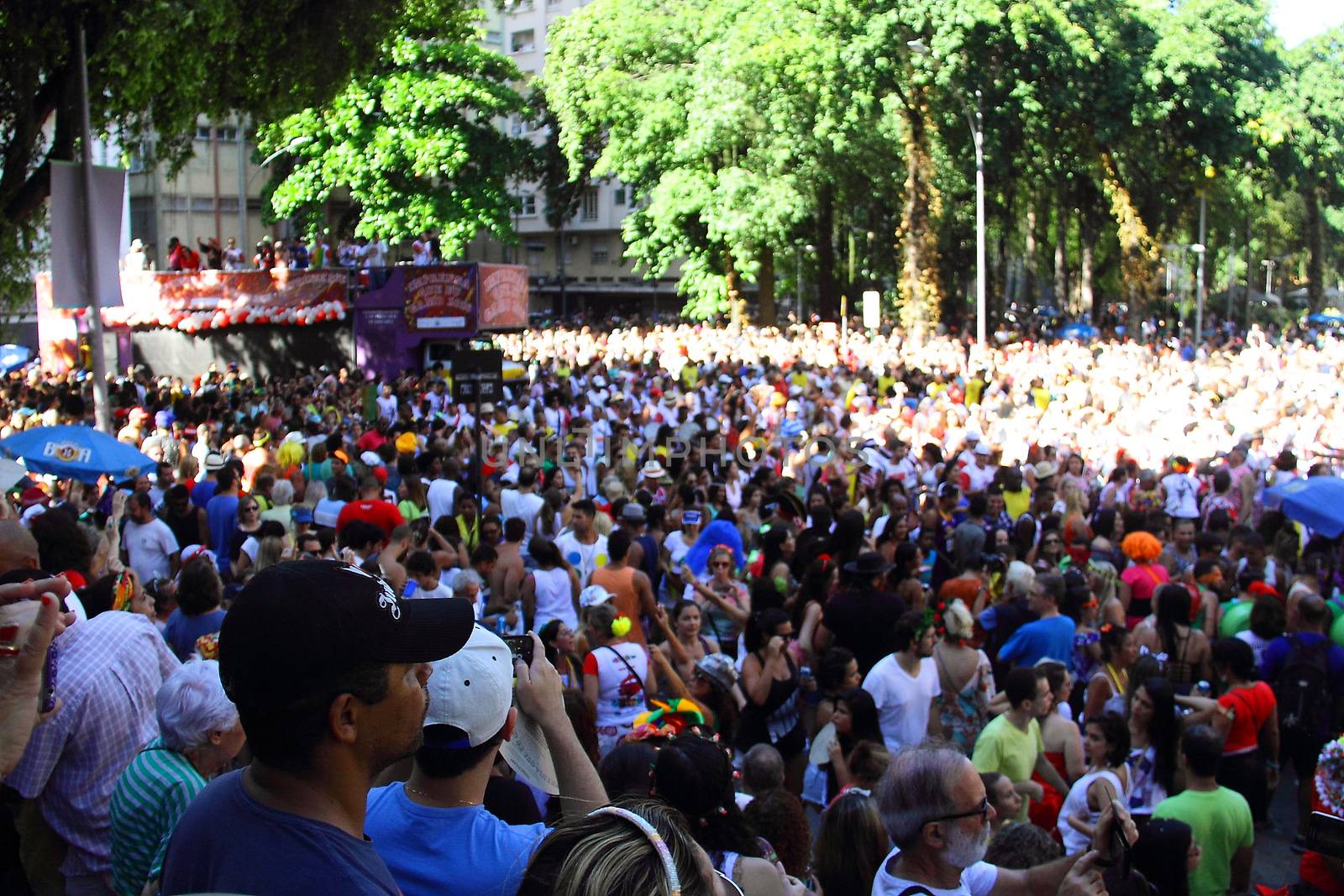 BRAZIL, Rio de Janeiro: Thousands of revelers take over the city on January 23, 2016 in a massive street party two weeks ahead of Carnival.  In the weeks leading up to the Carnival's official opening day on February 5, 2016, groups of people organize 'blocos', or street parties. Blocos are usually held in local neighbourhoods and feature brass bands and are much less formal than the parades.	 