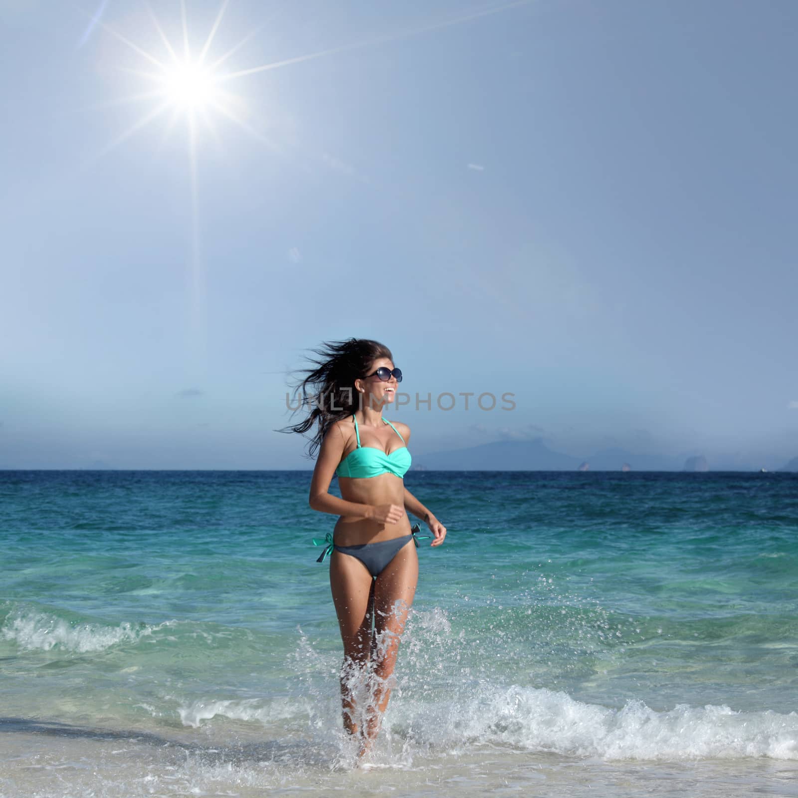 Woman in bikini run to beach by Yellowj