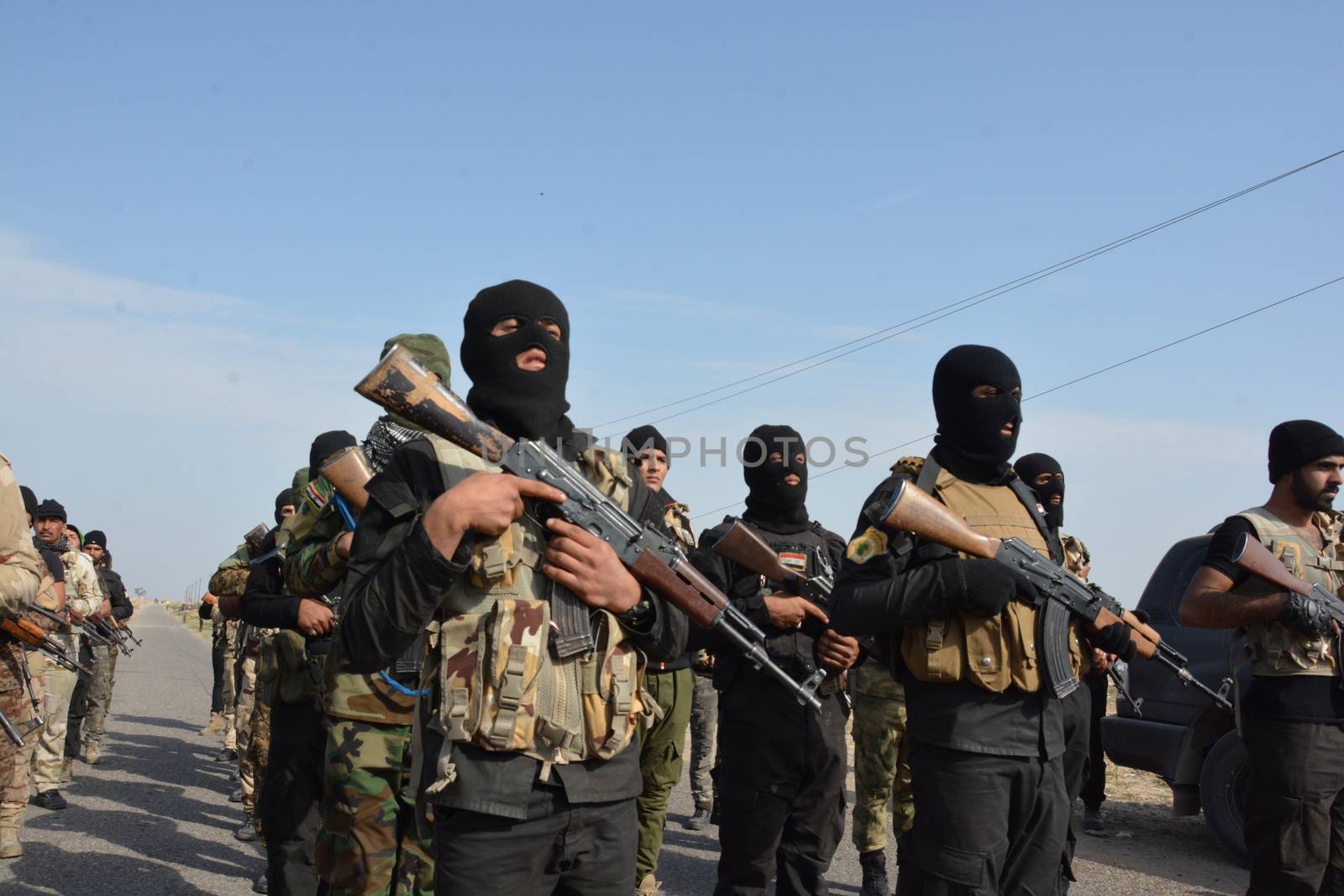 IRAQ, Al-Seneia: Soldiers gather in the town of Al-Seneia, on January 23, 2016, after the PMU liberated the city from ISIS.The city was liberated on October 14, 2015, according to commander of Imam Ali brigade who spoke with our contributor. ISIS is said to have destroyed much of the town including important building such as schools and hospitals.