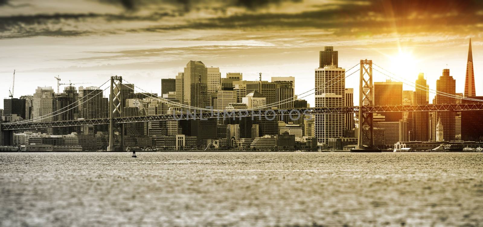 San Francisco Sunset Panorama with Oakland Bay Bridge. United States.