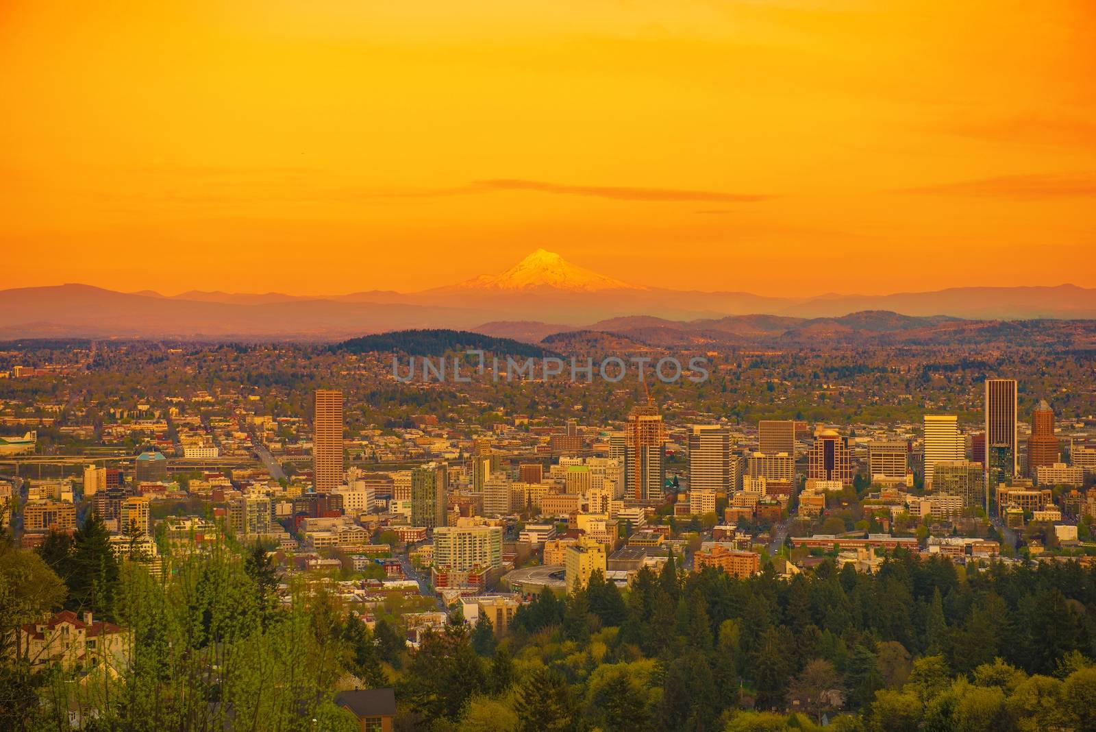 Scenic Sunset in Portland Oregon with Mount Hood on a Horizon. Portland Cityscape, United States.