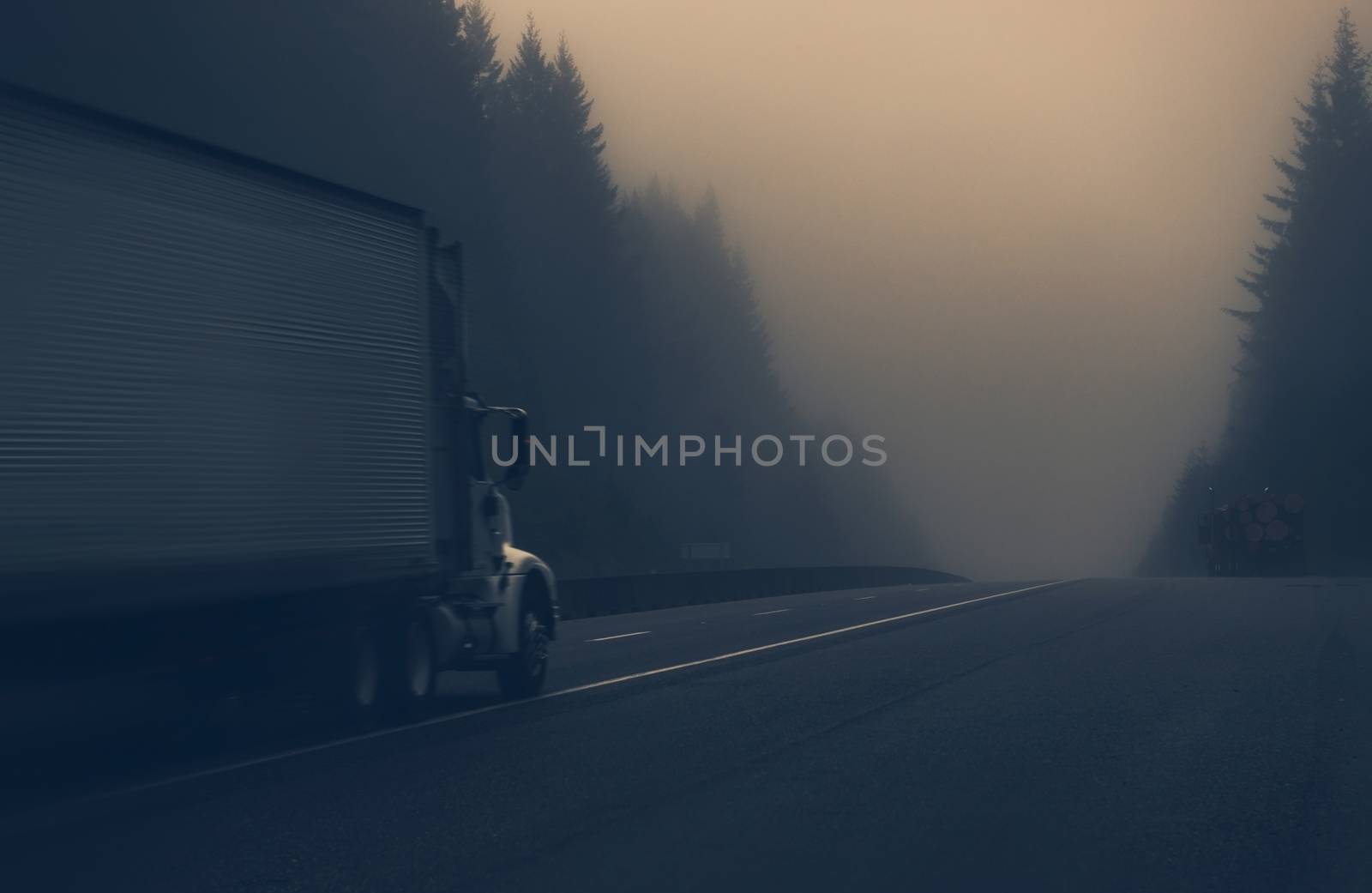 Trucks on the Foggy Highway in Northern California, United States. Foggy Day on the Road