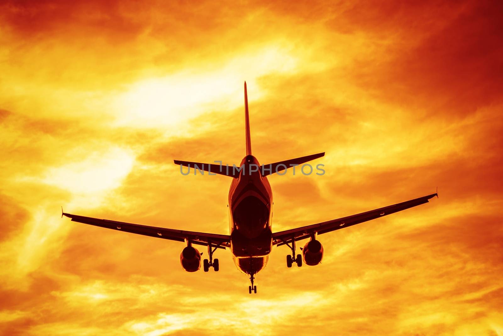 Business Flights Concept Photography. Commercial Airlines on the Sky During Sunset Take Off.