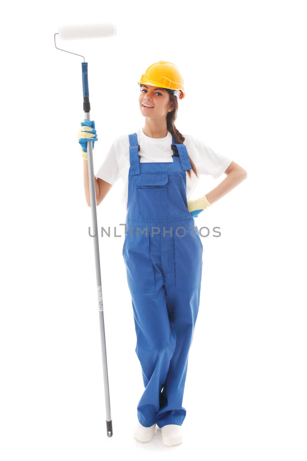 Young beautiful handywoman with paint roller isolated on white