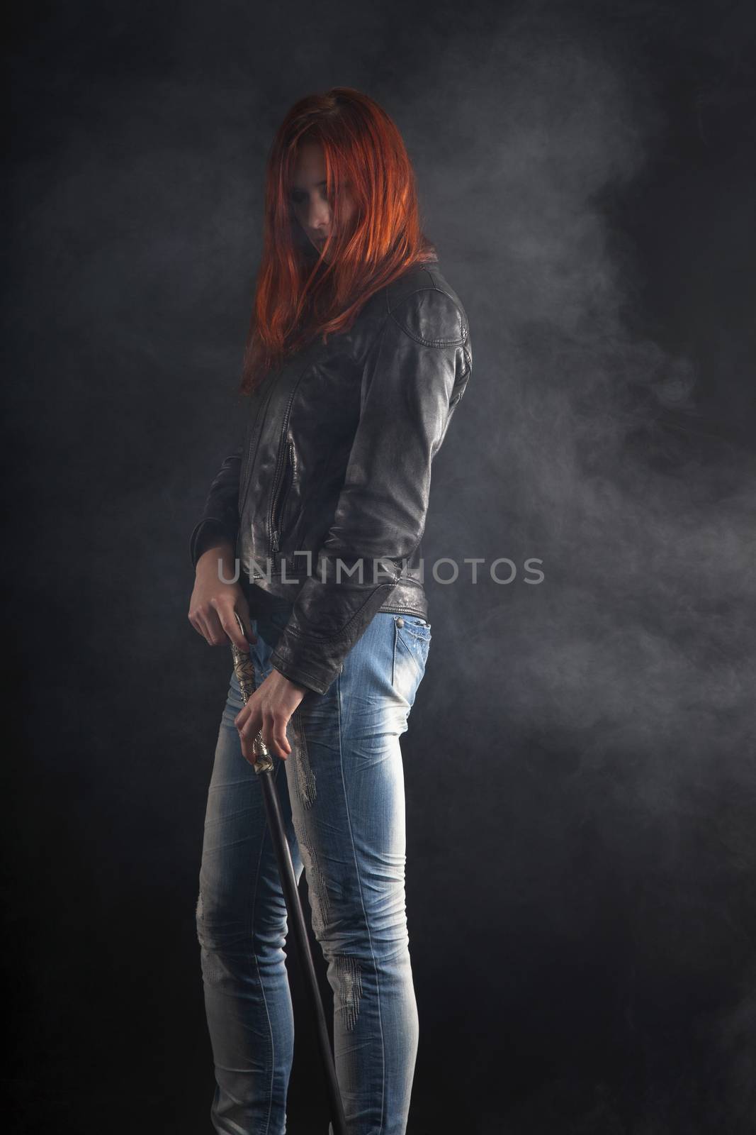 Portrait Of Woman Holding Stick In Smoke