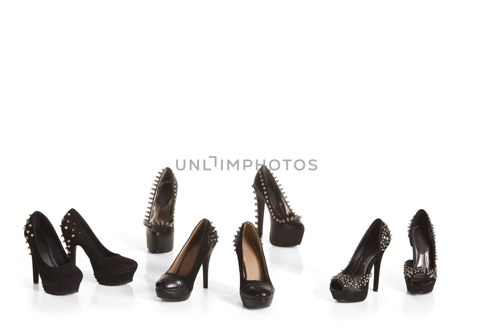 Collection of black high heel shoes on white background