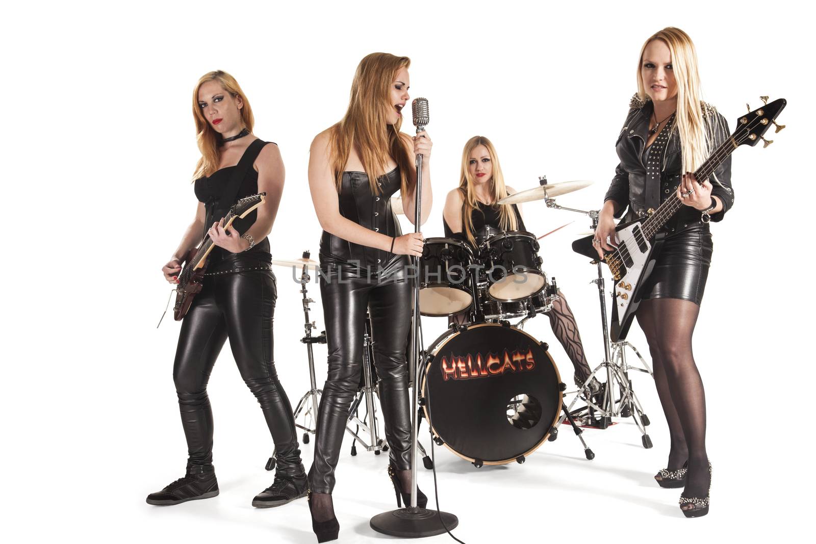 Portrait of female music band isolated over white background
