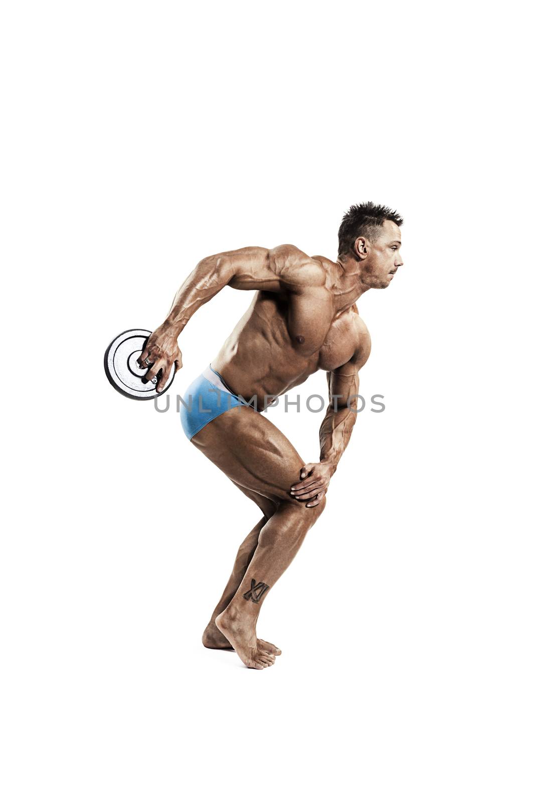 Man with weight training equipment on background
