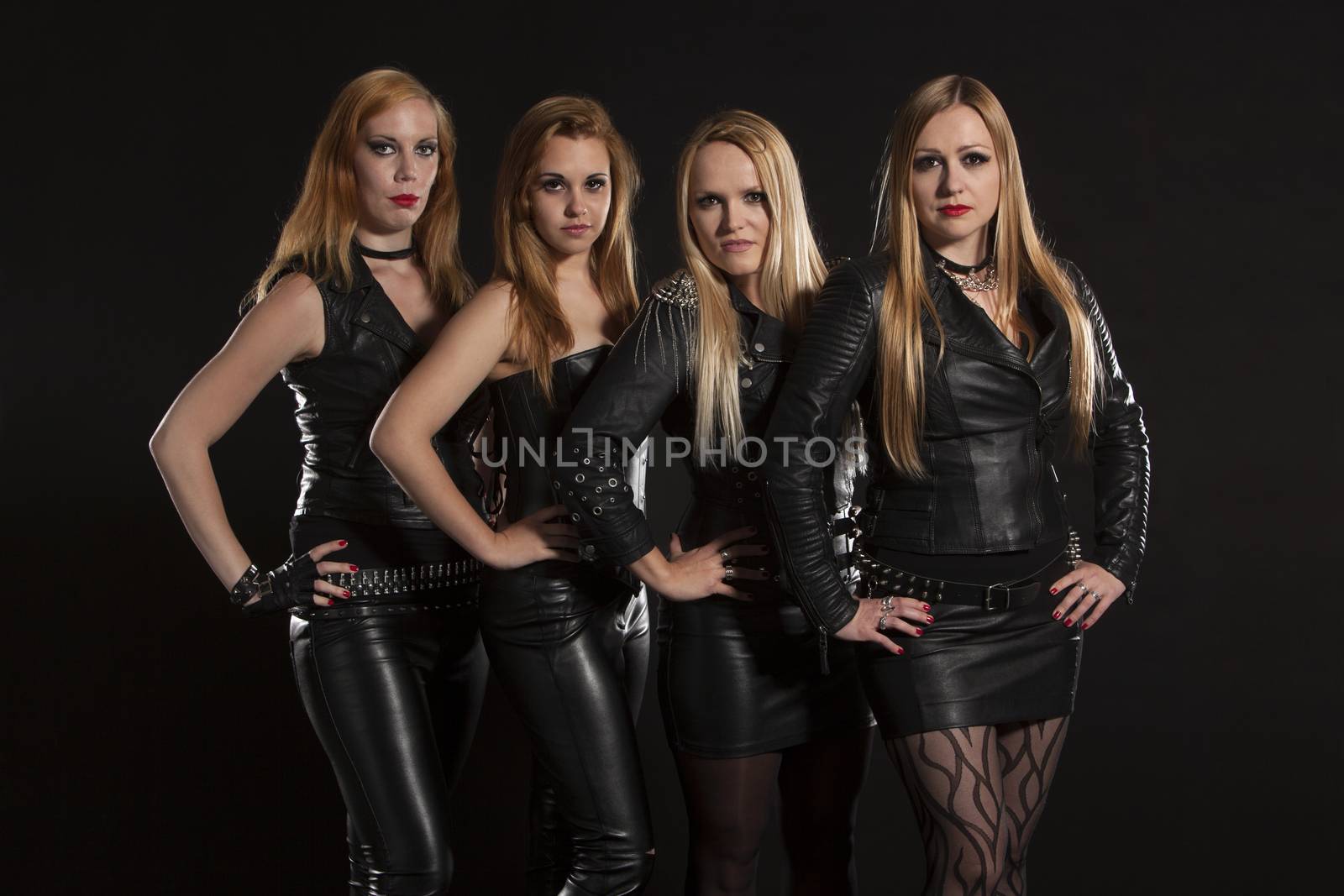 Group of young women wearing leather outfits by Aarstudio