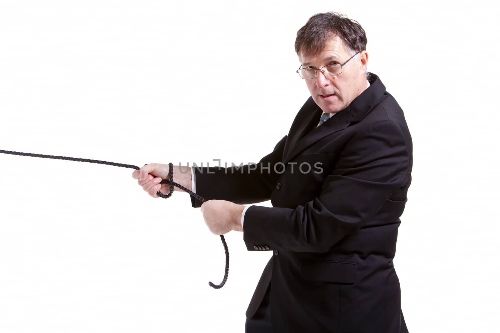 Business man pulling a rope