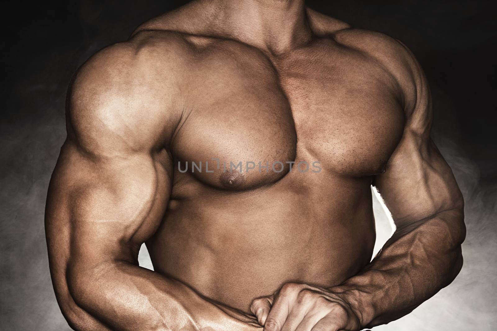 Close-up of muscular man with strong biceps