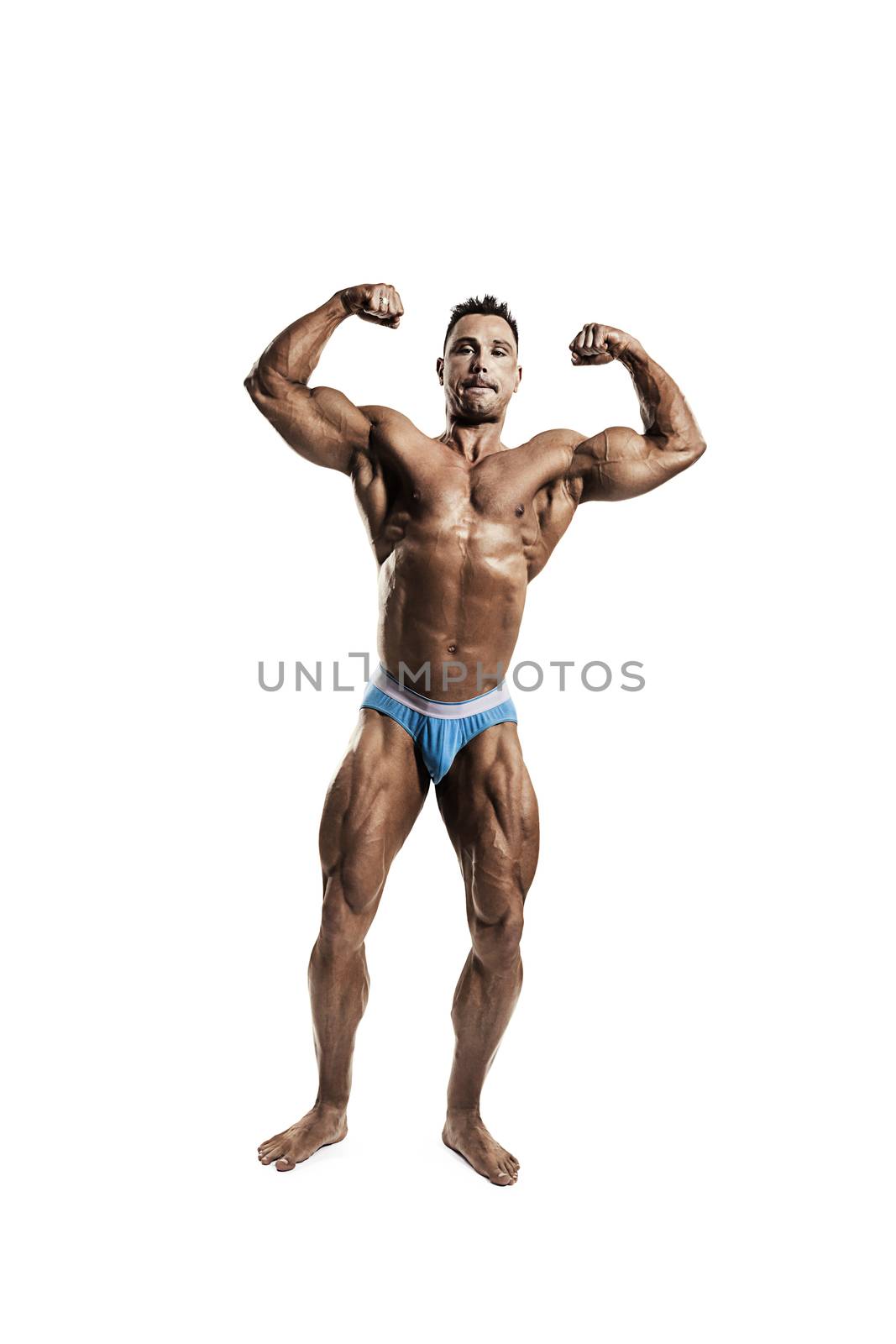 Portrait of male athlete flexing his muscles