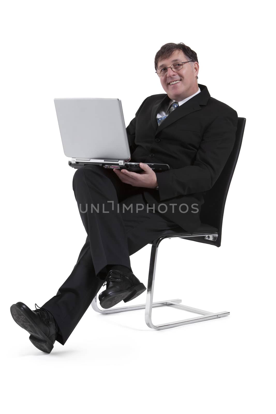 Portrait Of Mature Businessman With Laptop Isolated Over White Background