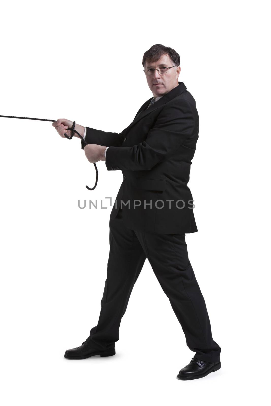 Portrait Of Mature Businessman Pulling Rope Over White Background