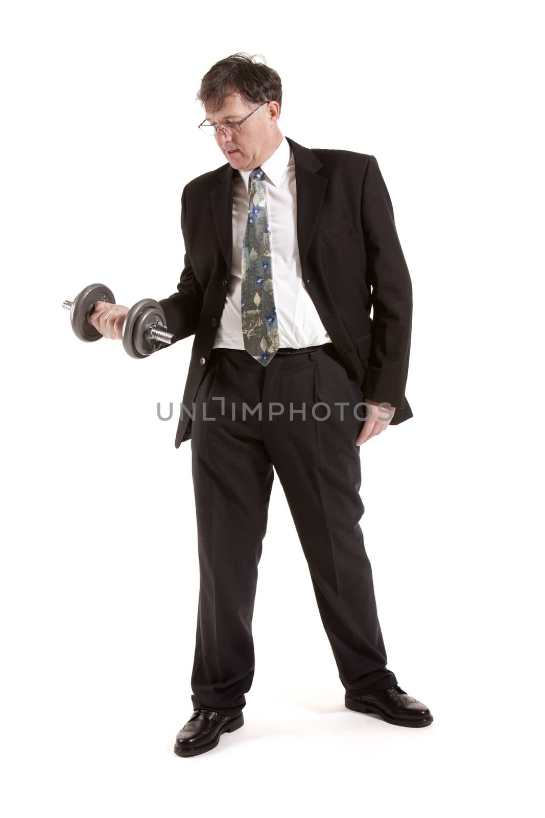 Mature Businessman Lifting Barbell Over White Background