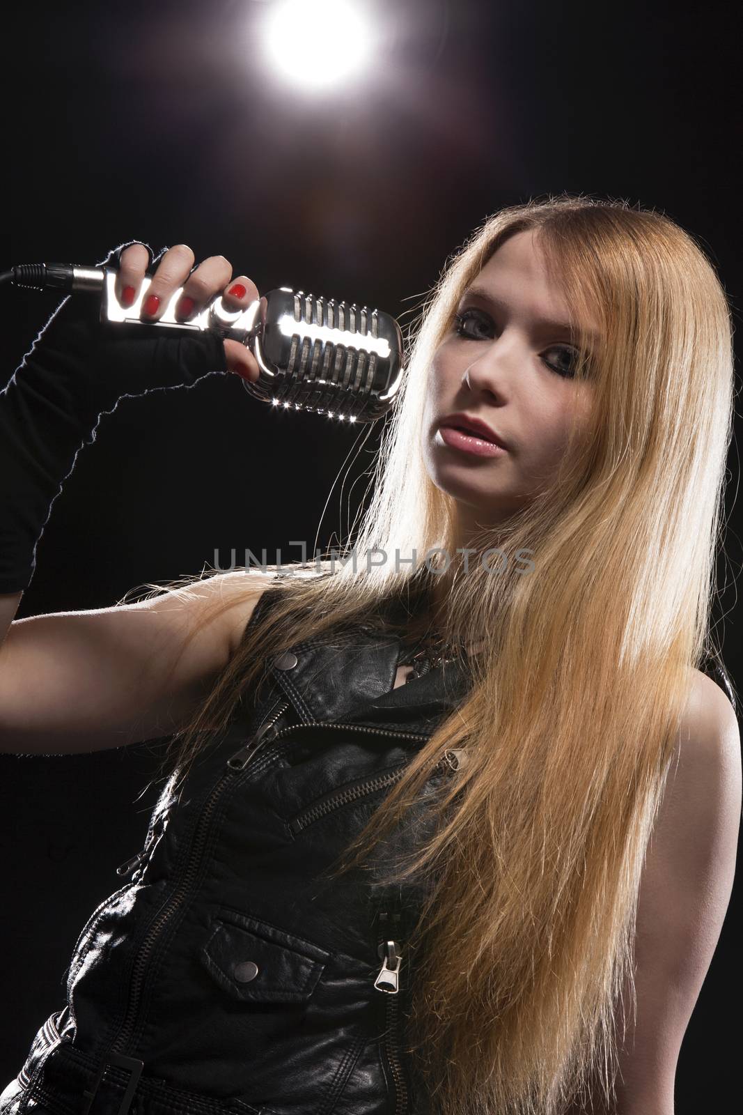 Young Woman Singing In Microphone; Indoors