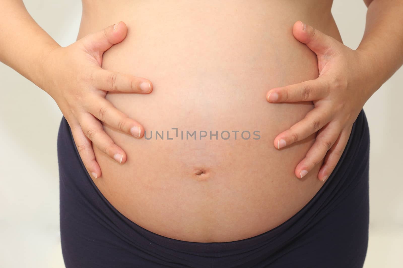 Photo of a cute pregnant woman belly