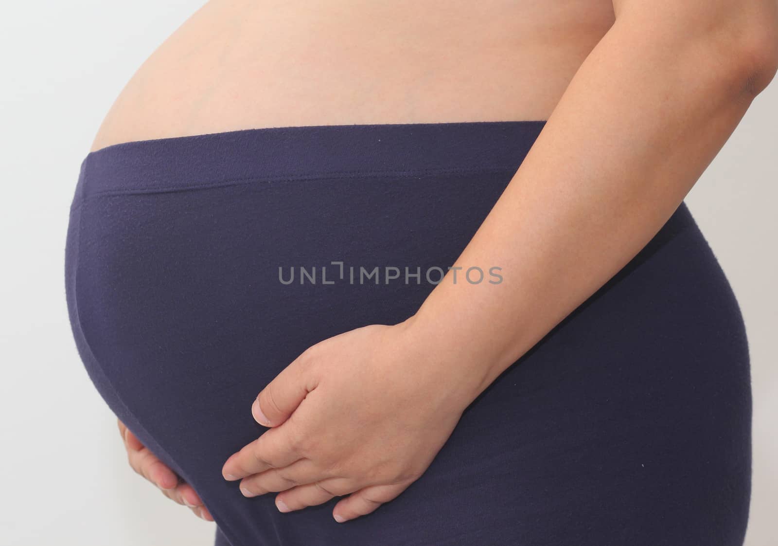 Photo of a cute pregnant woman belly