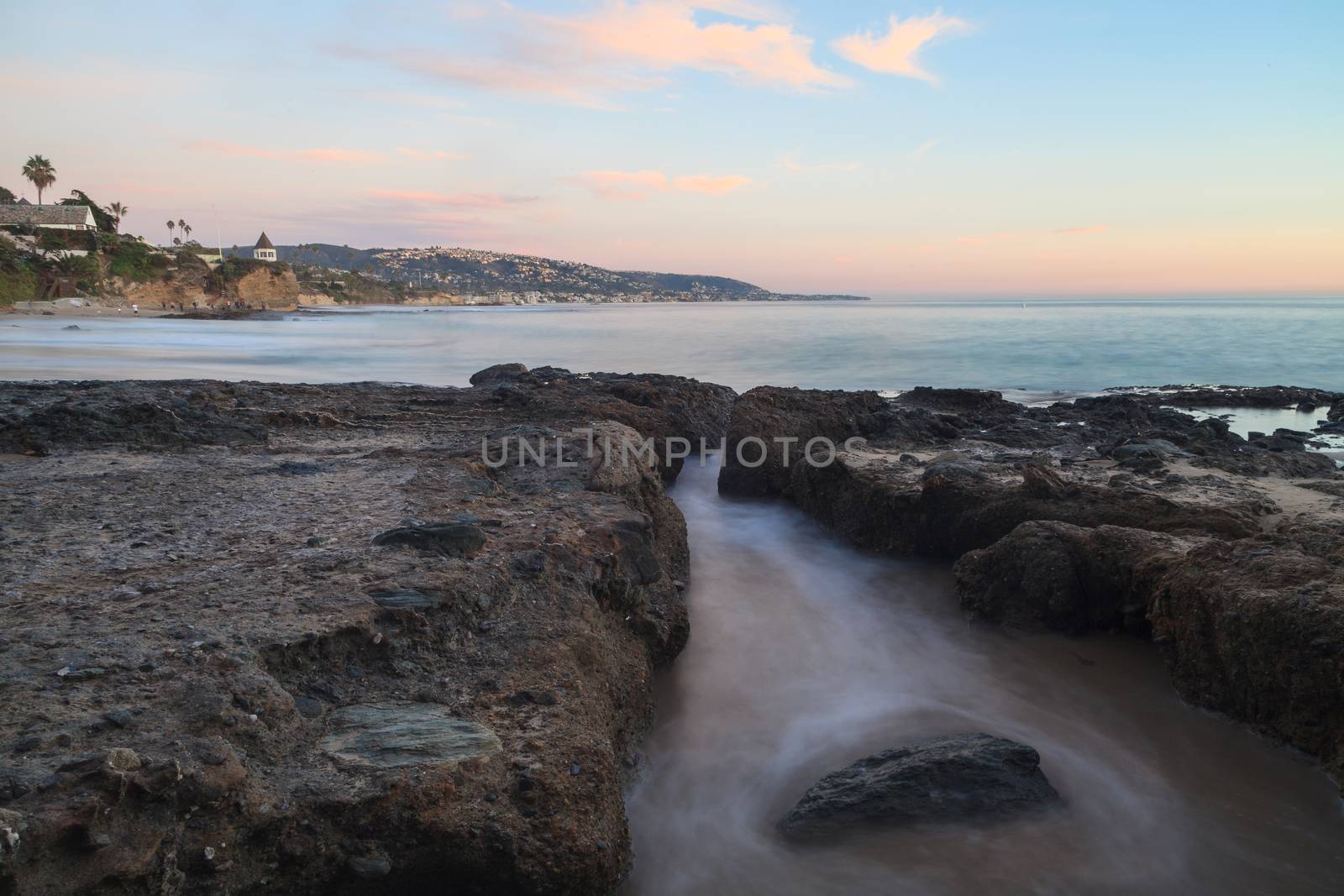 Long exposure of sunset over rocks by steffstarr