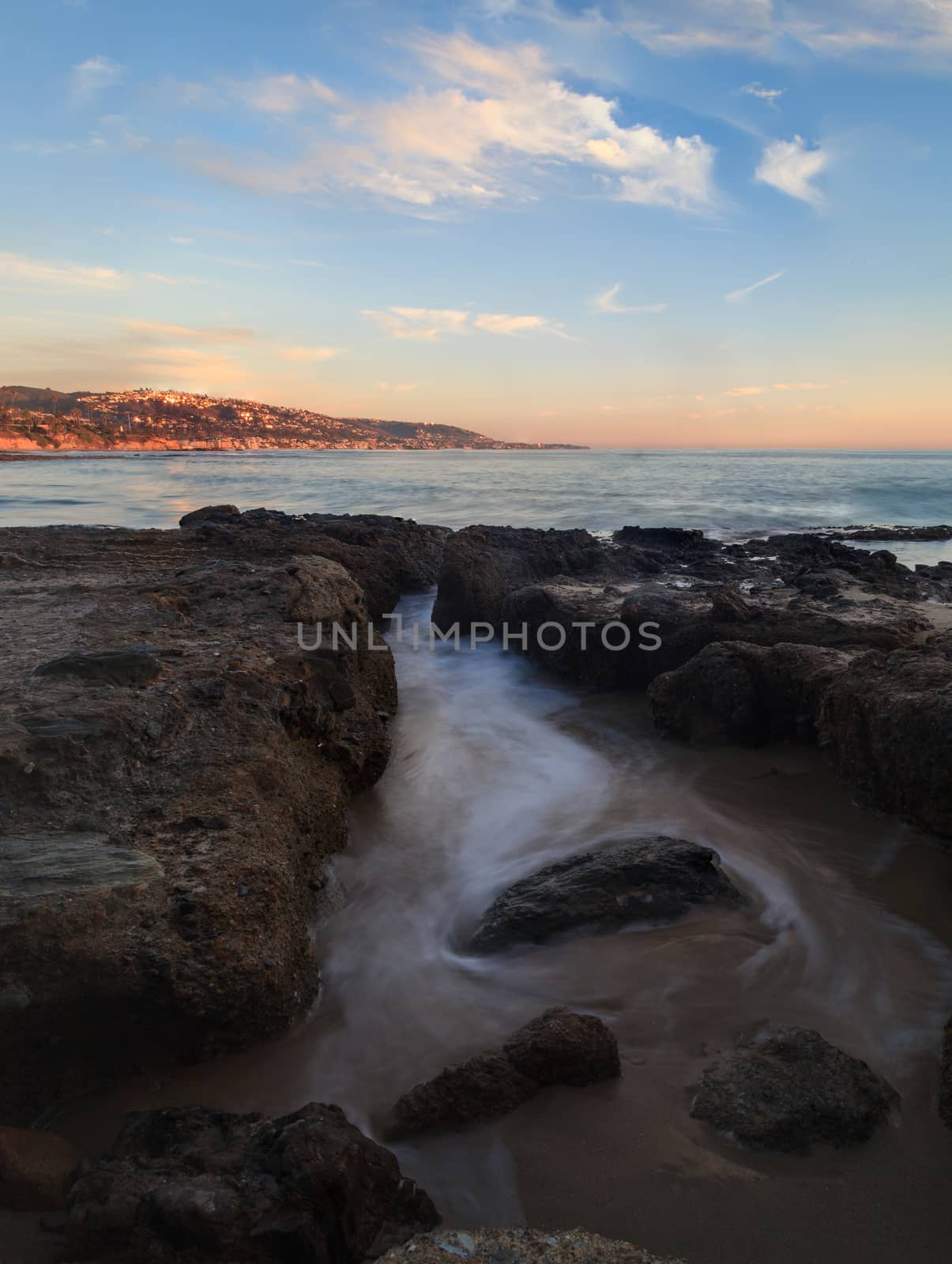 Long exposure of sunset over rocks by steffstarr