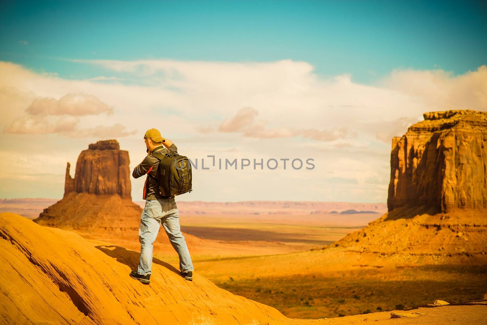 Travel Photographer at Work. Arizona Monuments Valley. Male Photographer.