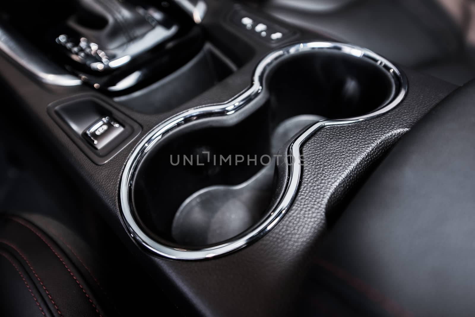 Vehicle Cup Holders in Between Front Car Seats. Cup Holder Closeup.