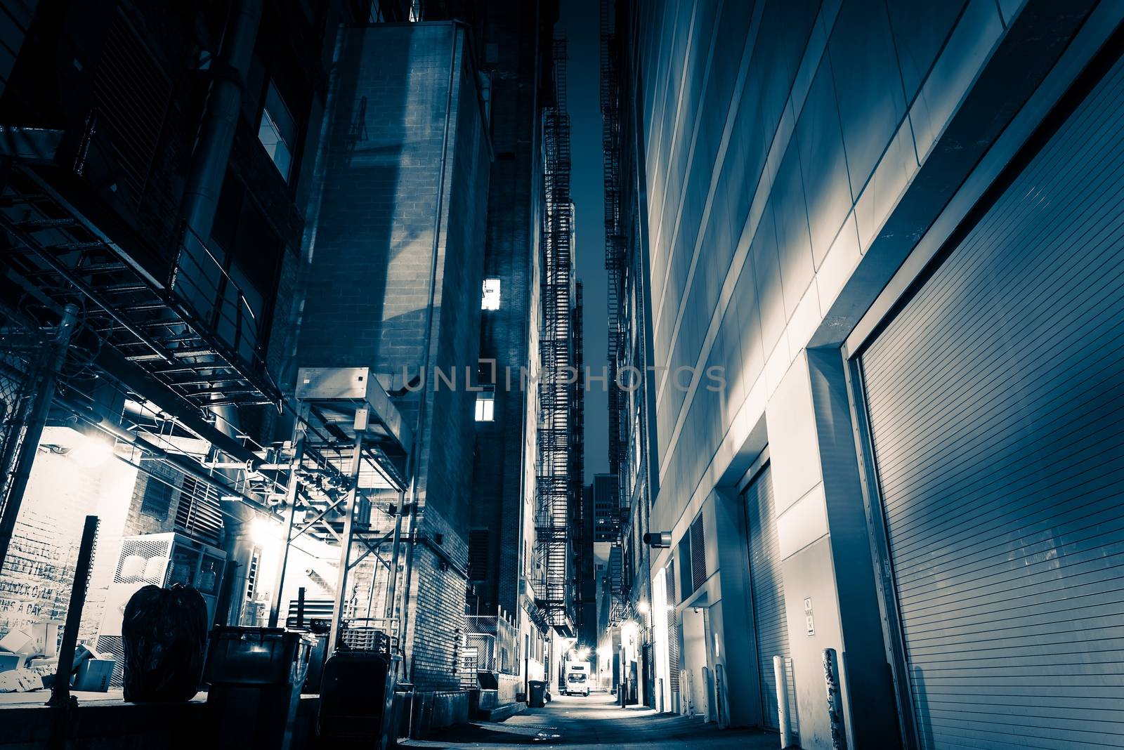 Big City Alley at Night. American Downtown Alley After Dark. Blue Color Grading.