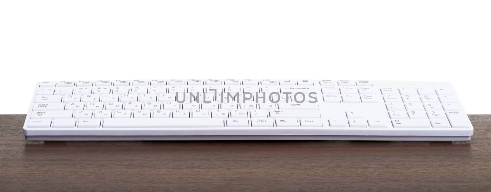Computer keyboard on table isolated on white background
