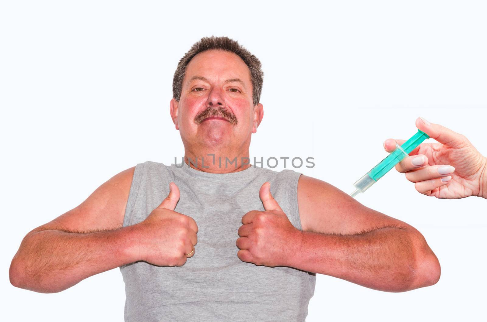 Thumbs up! Man showing two thumbs up. On the right edge of a hand with syringe.