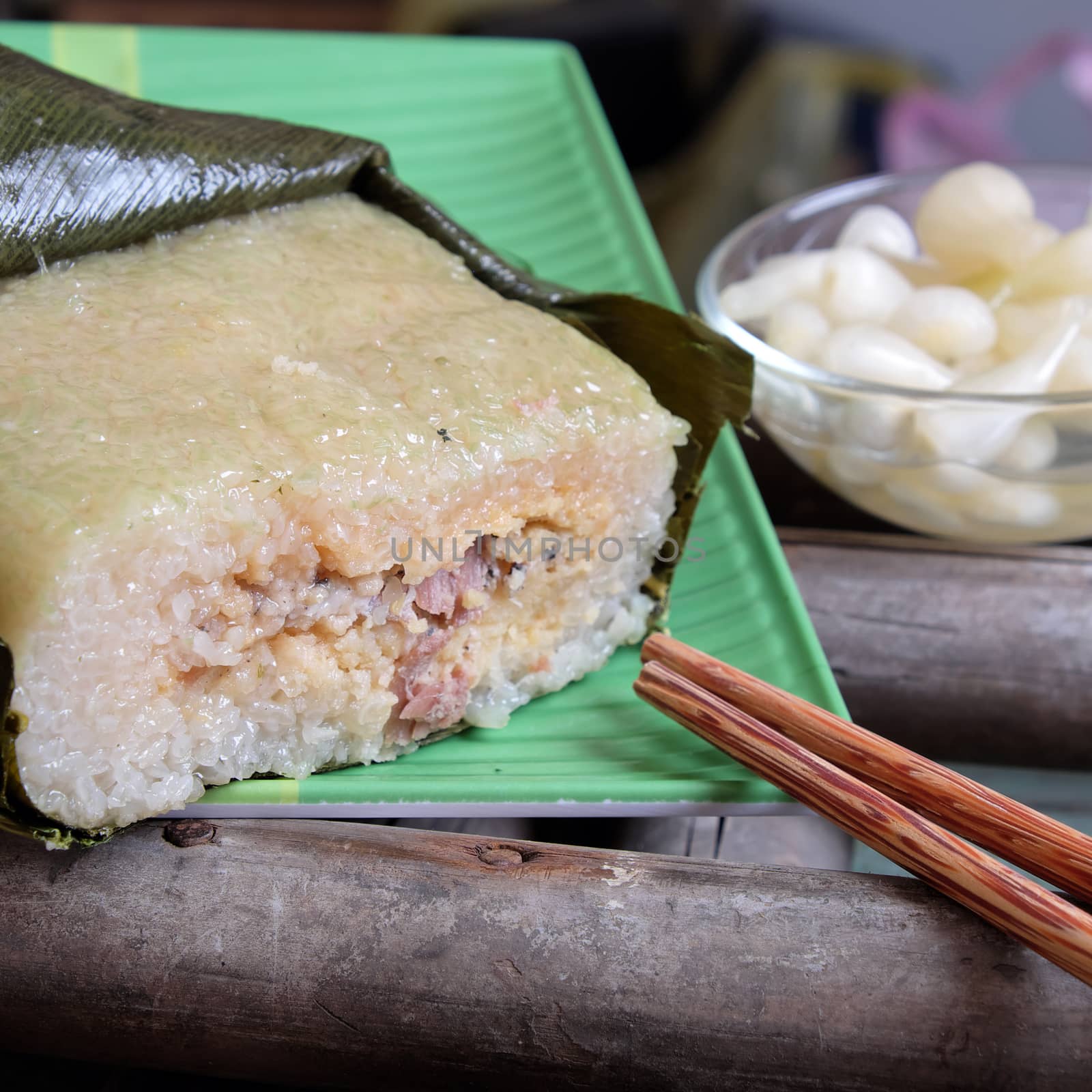 Vietnamese food for Tet holiday in spring, banh chung is traditional food on lunar new year, a rice cake stuffed with pork, green bean, is tradition culture in spring