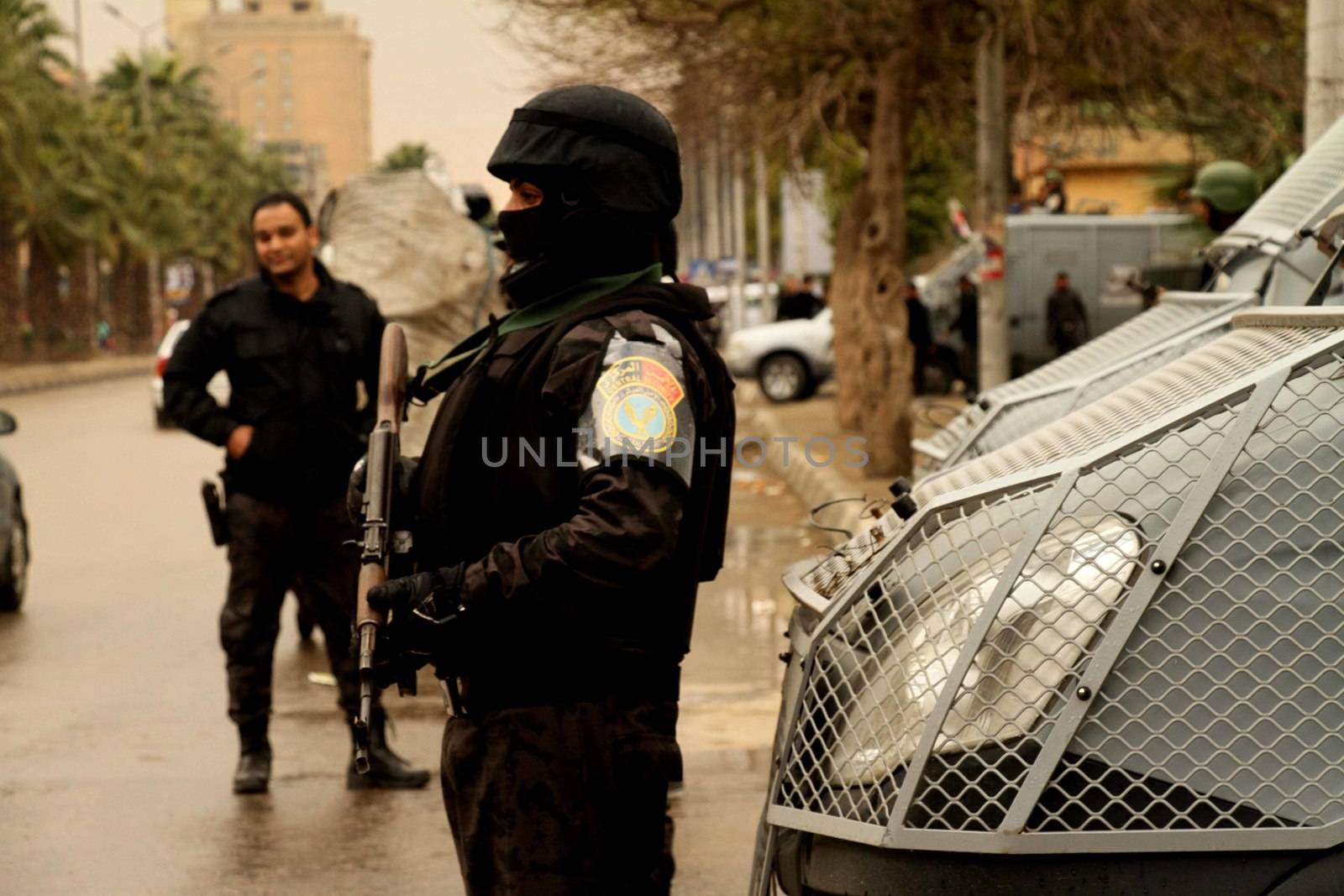 EGYPT, Cairo: A security force member stands watch in Cairo, on January 25, 2016, on the 5 year anniversary of the 2011 uprisings. Tahrir Square saw a large security presence, after armed clashes broke out the previous two years between police and demonstrators.