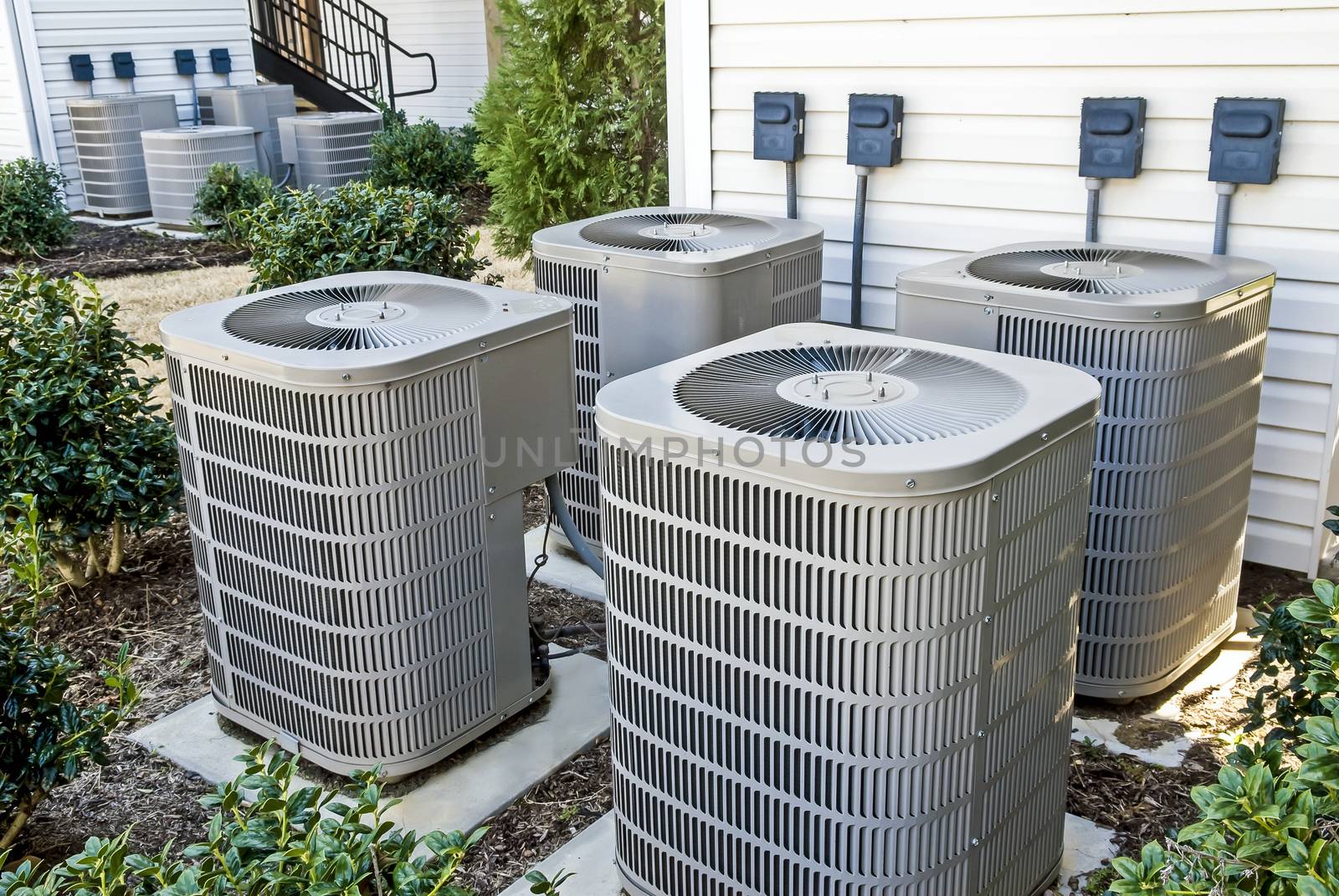 Group of air conditioning units at apartment complex