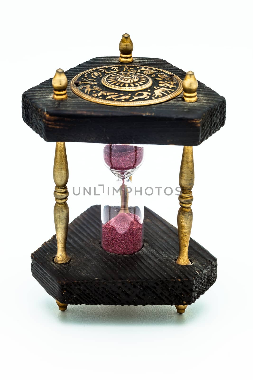 A wooden old sandglass isolated on white background