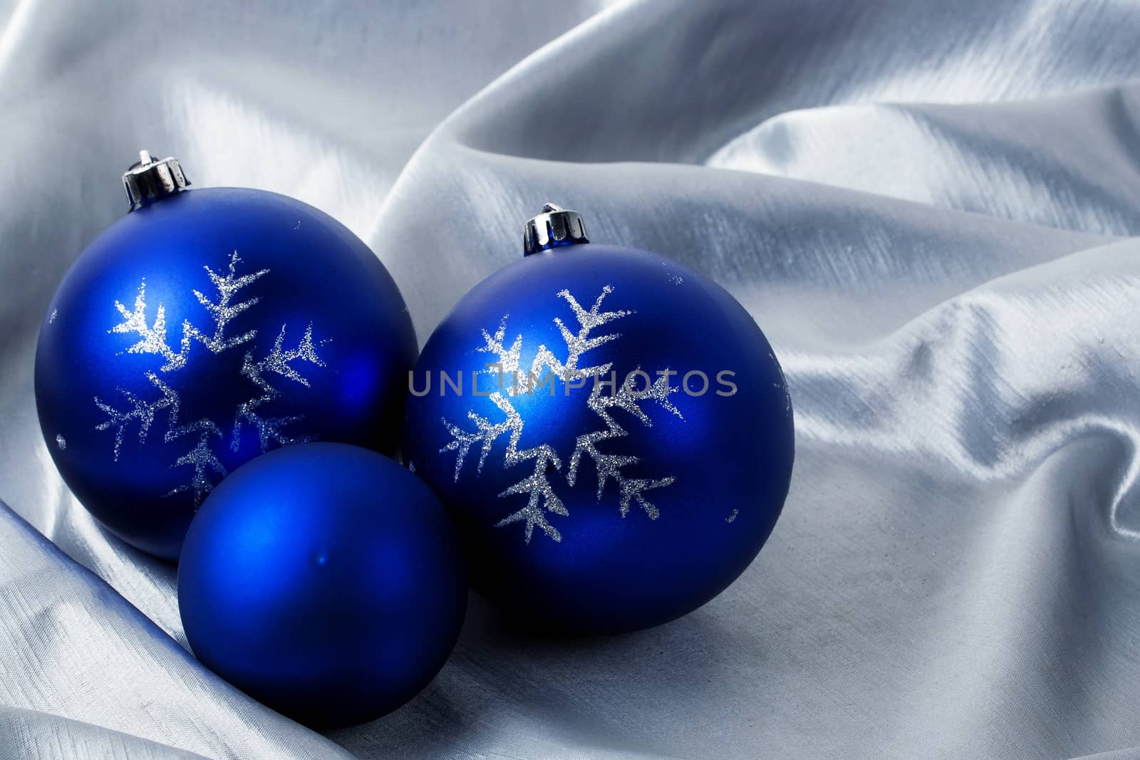 Christmas blue balls on a silver background