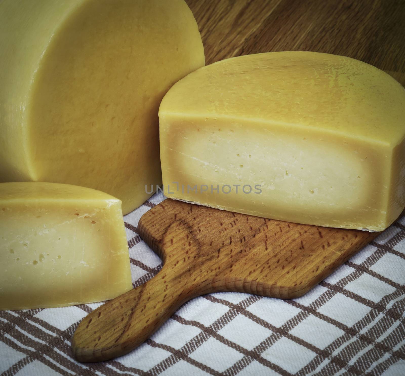 retro still life Round sliced hard cheese