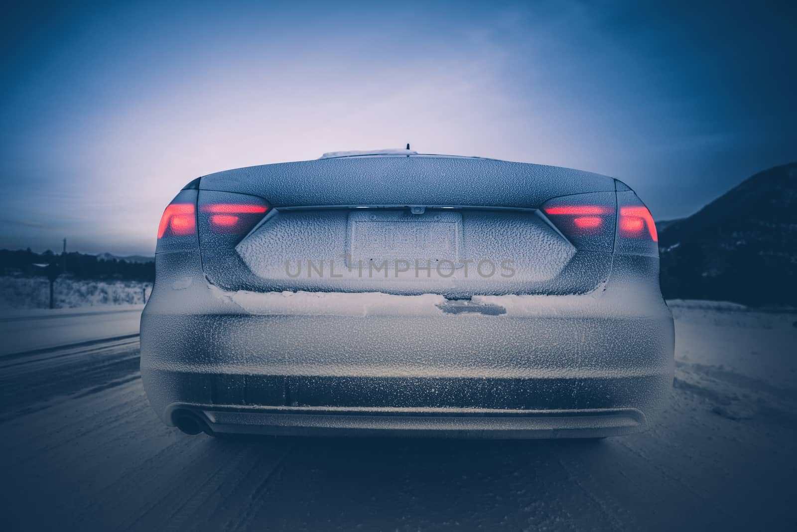 Hazardous Winter Drive. Rear of the Car Covered by Snow. Winter Travel.