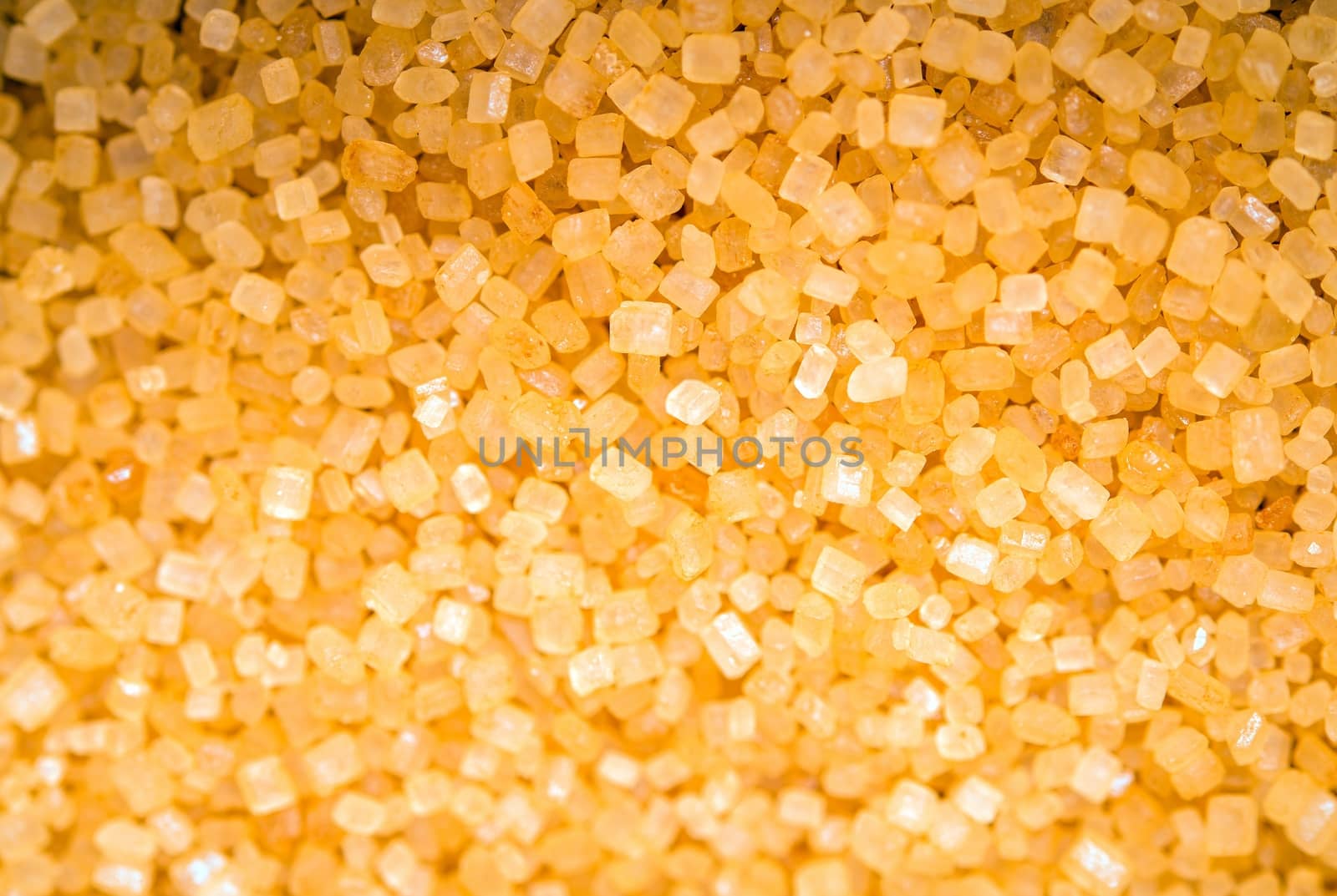 Raw Brown Sugar Closeup. Raw Sugar Crystals Macro Photo.