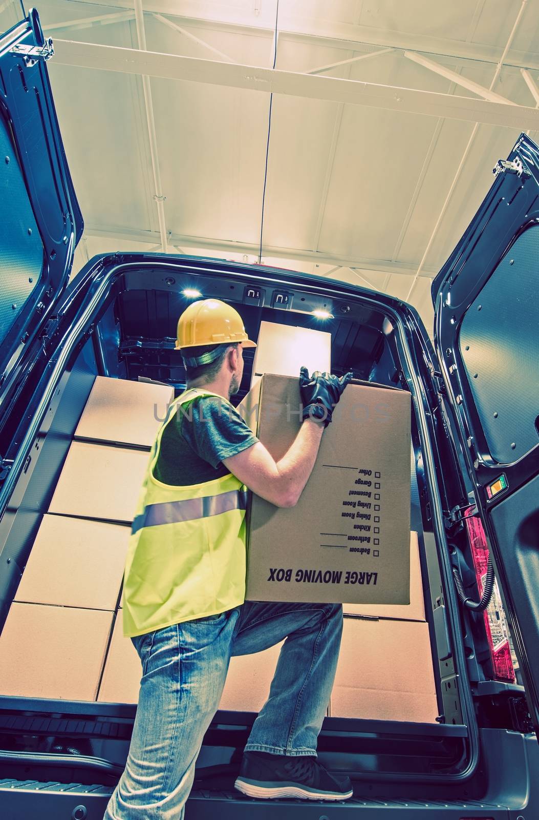 Shipment Van Delivery. Men Reloading Cargo From the Van. Shipping and Logistic Theme.