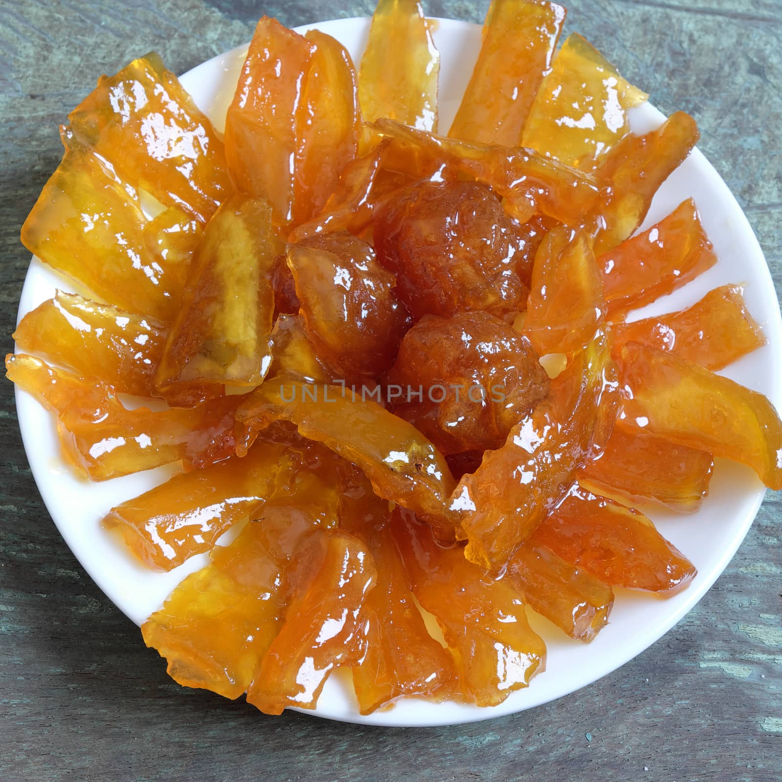 Vietnamese food for Tet holiday in spring, mango jam, sweet eating is traditional food on lunar new year, can make from mango fruit cook with sugar,  amazing background for Vietnam culture